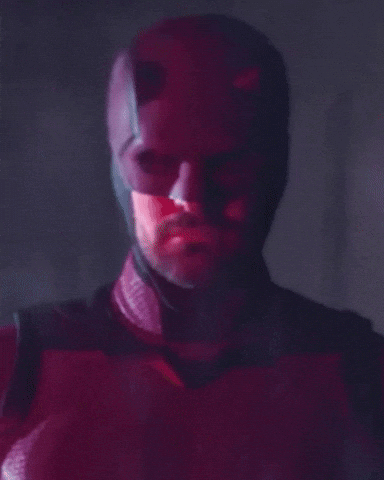 Man's Face Close Up in Red and Black Costume