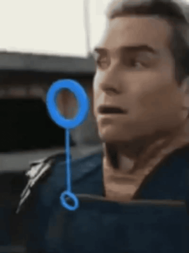 Man's Face Close Up With Blue Circle GIF