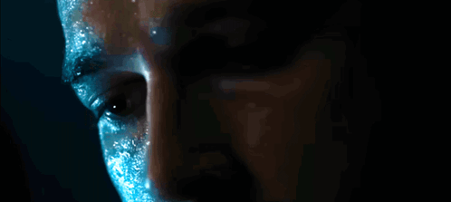 Man's Face Close Up with Blue Paint