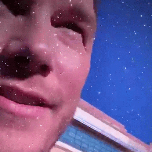 Man's Face Close Up with Falling Snow