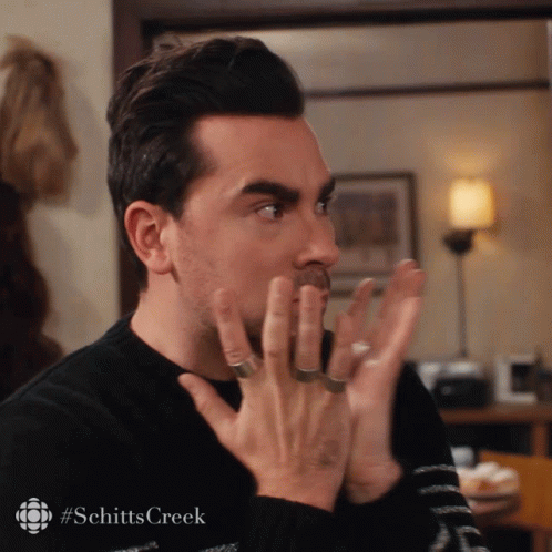 Man's Face Close Up with Schitts Creek Hashtag