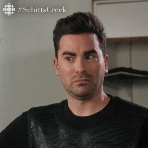 Man's Face Close Up with Schitts Creek Logo