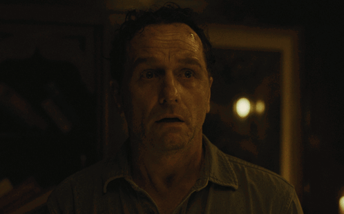 Man's Face in Dark Blurred Room