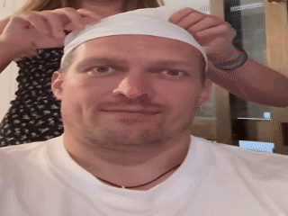 Man's Face in Dark Room