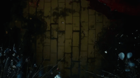 Man's Face In Dark Room With Red Lights GIF