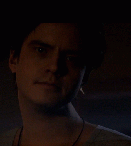 Man's Face in Dark Room