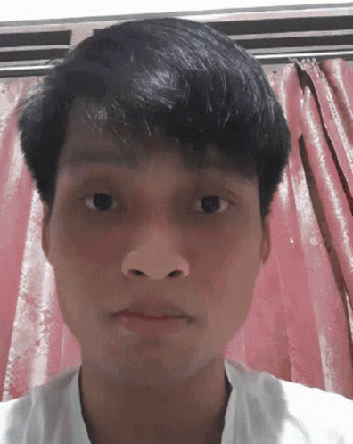 Man's Face in Front of Pink Curtain