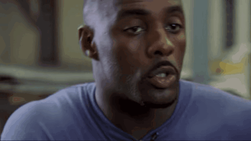 Man's Face in Purple Shirt