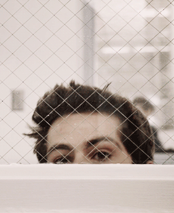 Man's Face Through Wire Fence