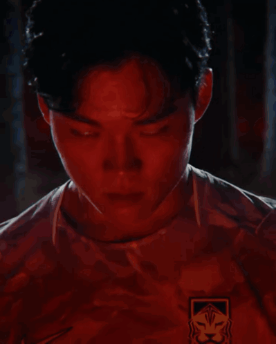 Man's Face With Red Lights Behind