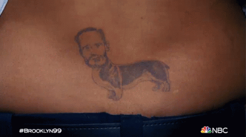 Man's Head On Dog Body Tattoo GIF