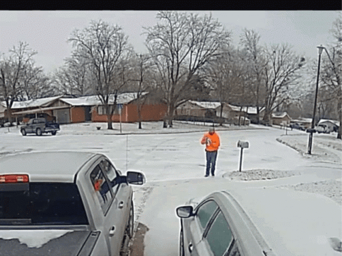 Man's Hilarious Struggle With Slipping On Ice Caught On Camera GIF