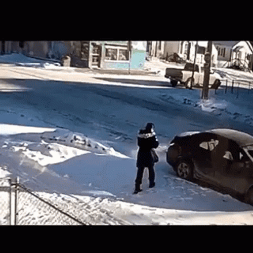Man's Winter Struggle Of Slipping On Ice GIF