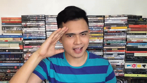 Man Salutes Stack of DVDs Saying Life Fi