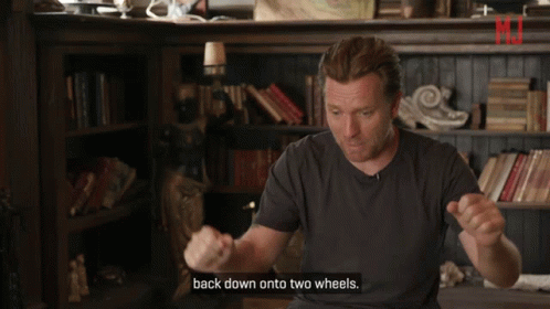 Man Saying Back Down onto Two Wheels