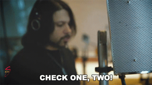 Man Saying Check One Two Into Microphone GIF