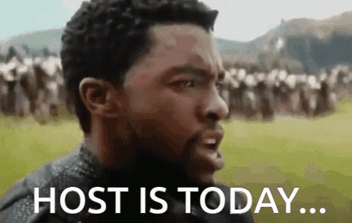 Man Saying Host Is Today in Front of Group