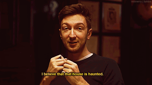 Man Saying I Believe That House Is Haunted In Dark Room GIF