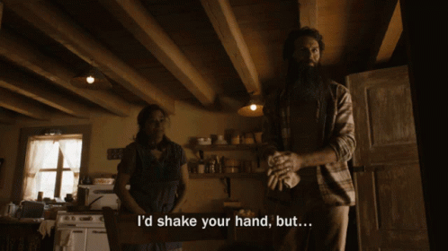 Man Saying I'd Shake Your Hand But In Kitchen With Woman GIF