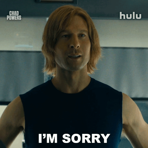 Man Saying I'm Sorry in Front of Hulu Sign