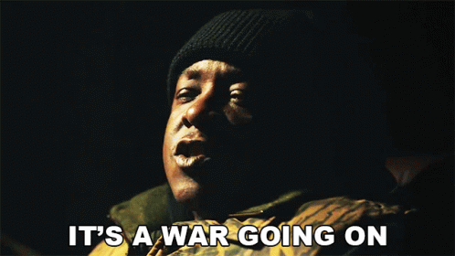 Man Saying It's a War Going On Dark Room