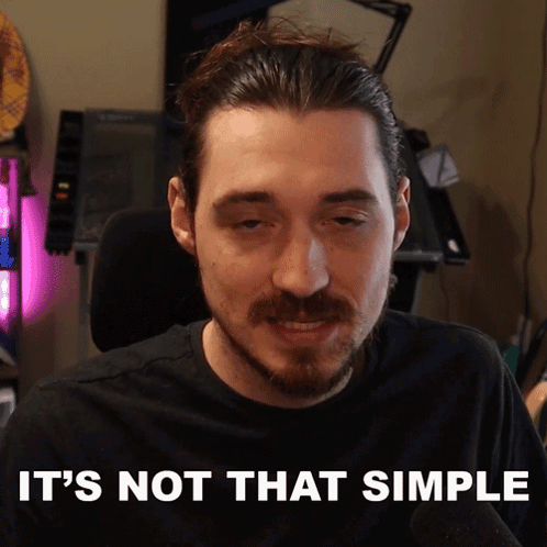 Man Saying It's Not That Simple at Computer