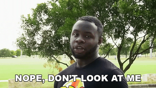 Man Saying Nope in Front of Field