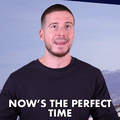 Man Saying Now's The Perfect Time With Mountain Background GIF