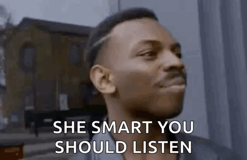 Man Saying She Smart You Should Listen In Front Of Building GIF