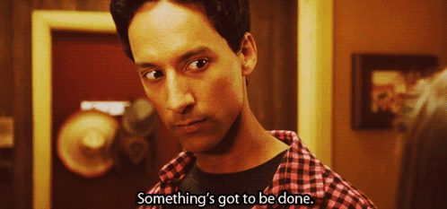 Man Saying Something In Front Of Red Door GIF
