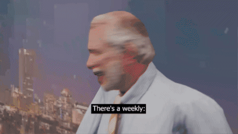 Man Saying There's a Weekly in Front of Sign
