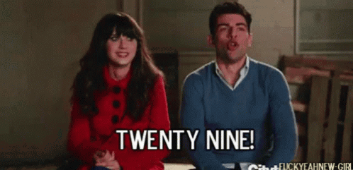 Man Saying Twenty Nine Next to Woman