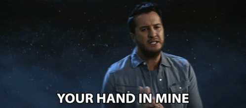 Man Saying Your Hand In Mine In Dark Room GIF