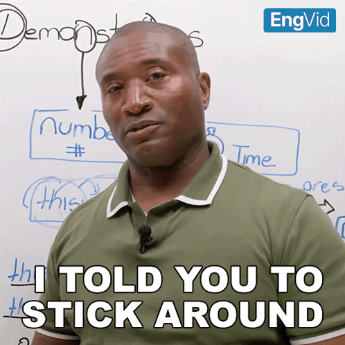 Man Says I Told You to Stick Around in Front of Whiteboard