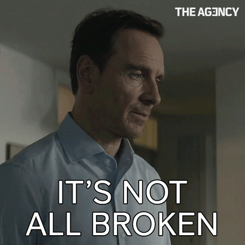 Man Says It's Not All Broken In Front Of The Agency Sign GIF