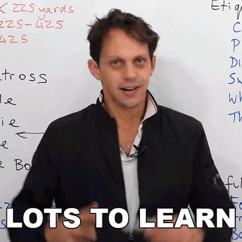 Man Says Lots to Learn in Front of White Board