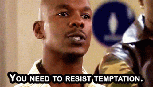 Man Says You Need to Resist Temptation Next to Blue Sign
