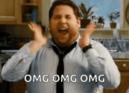 Man Screaming in Kitchen Wearing Tie