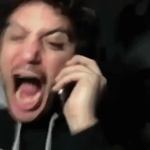Man Screaming on Cell Phone