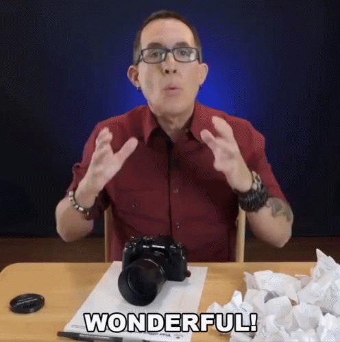 Man Seating Introducing Camera Wonderful GIF