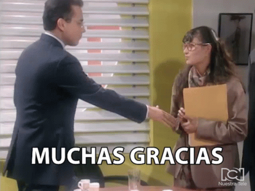 Man Shaking Hands With Woman Muchas Gracias GIF