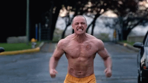 Man Shirtless Fists in Air