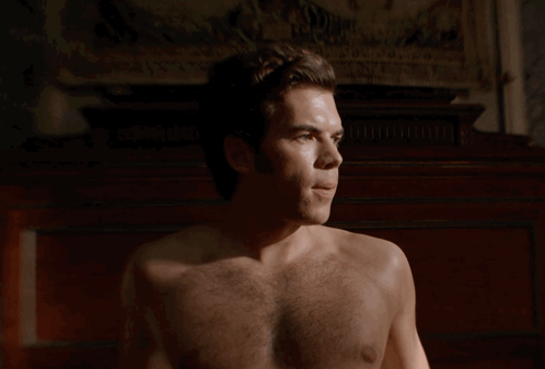 Man Shirtless Looking at Camera
