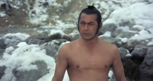 Man Shirtless Standing by Snowy River