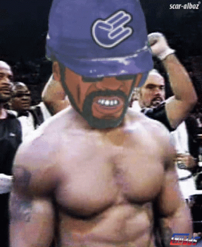 Man Shirtless Wearing Blue Hat With Hand Symbol GIF