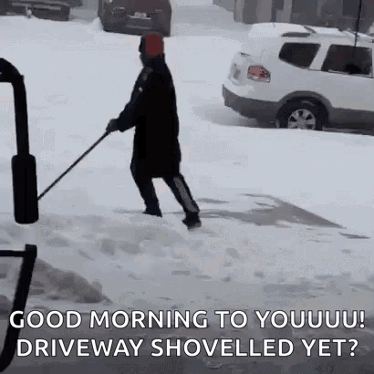 Man Shoveling Snow on Driveway