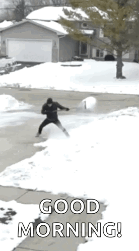 Man Shoveling Snow With Dog Watching