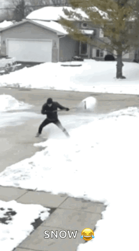 Man Shoveling Snow With Smiley Snow Sign