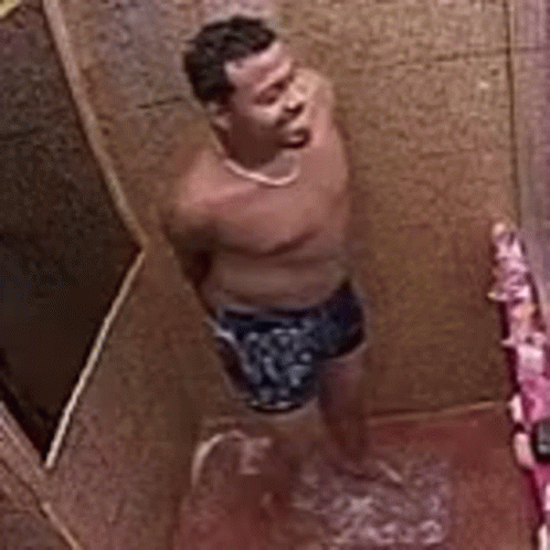 Man Showering in Bathroom