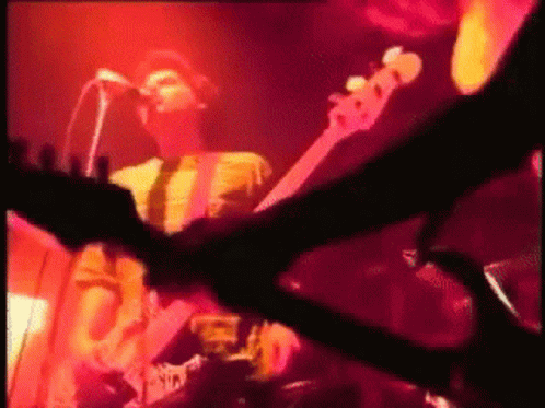 Man Singing and Playing Guitar